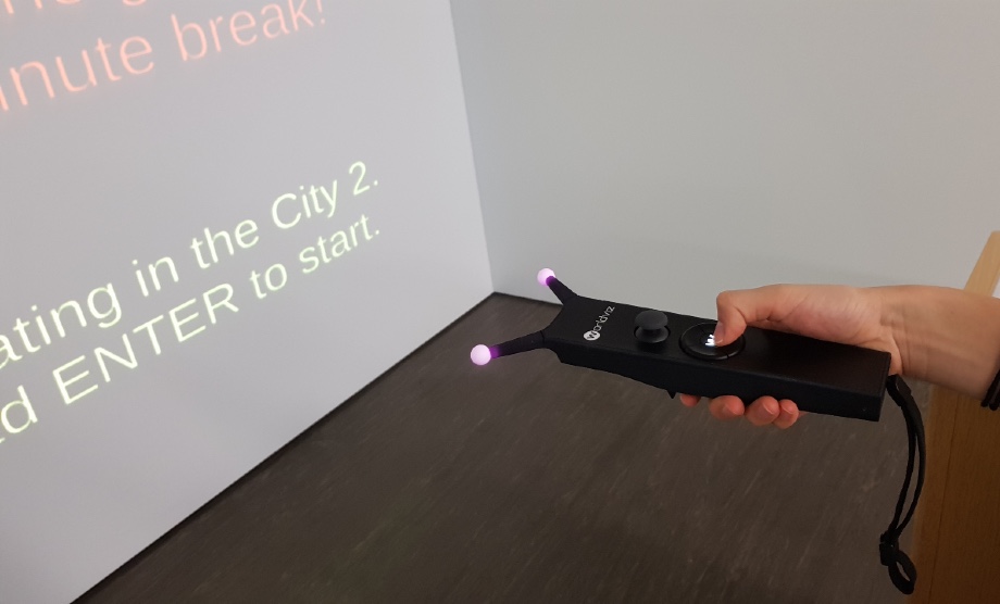 Using wireless interaction wand to interact with virtual environments