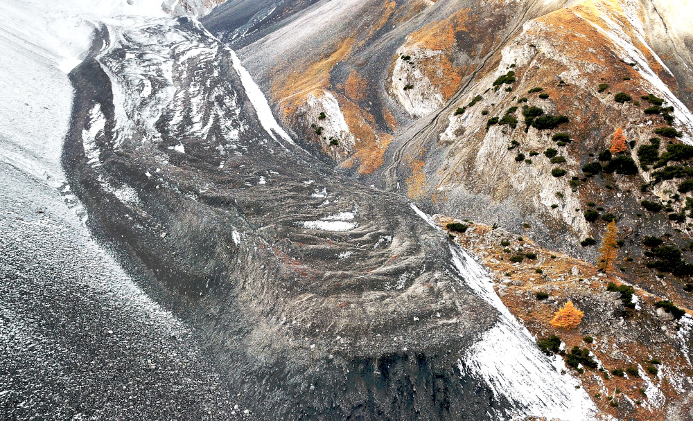 The rockglacier Val da l’Acqua is one of the first rockglaciers described and investigated systematically (view from drone, A. Cicoira, autumn 2019).